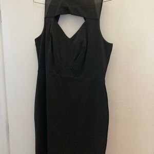 Little black dress with leather trim and cut outs.